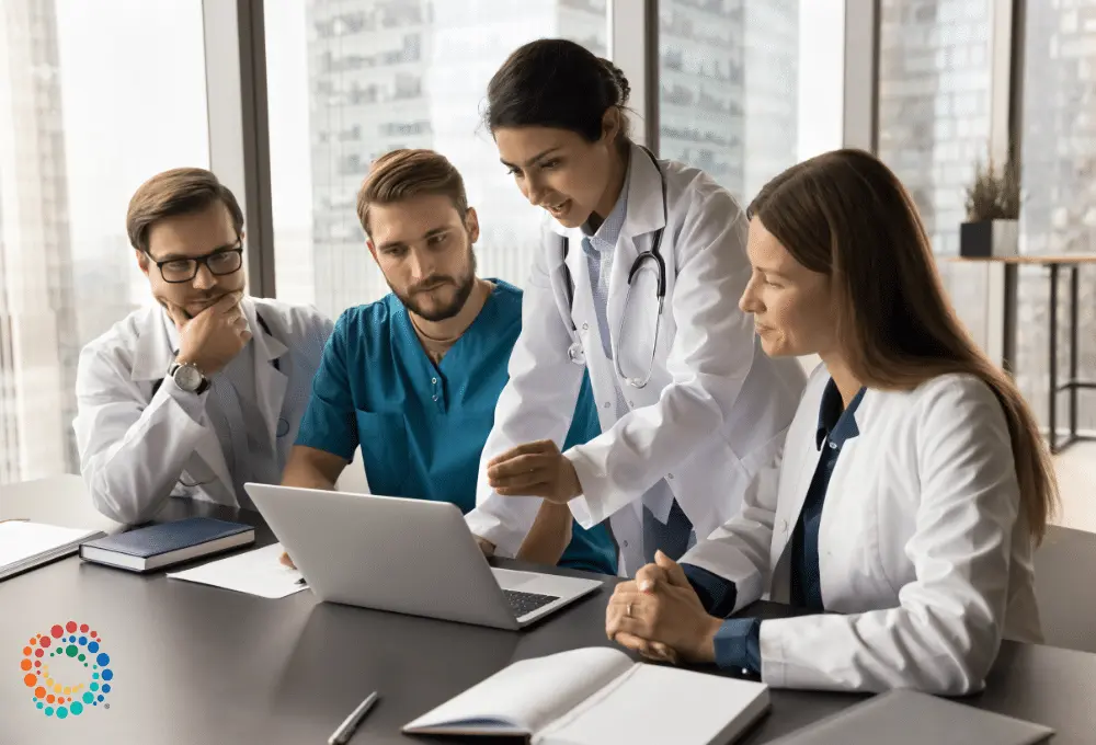 Group of doctors working at computer